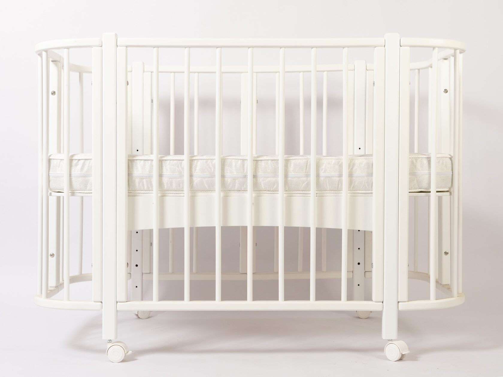 Кроватка КАРАМЕЛЬ с комплектом матрасов и маятником 2